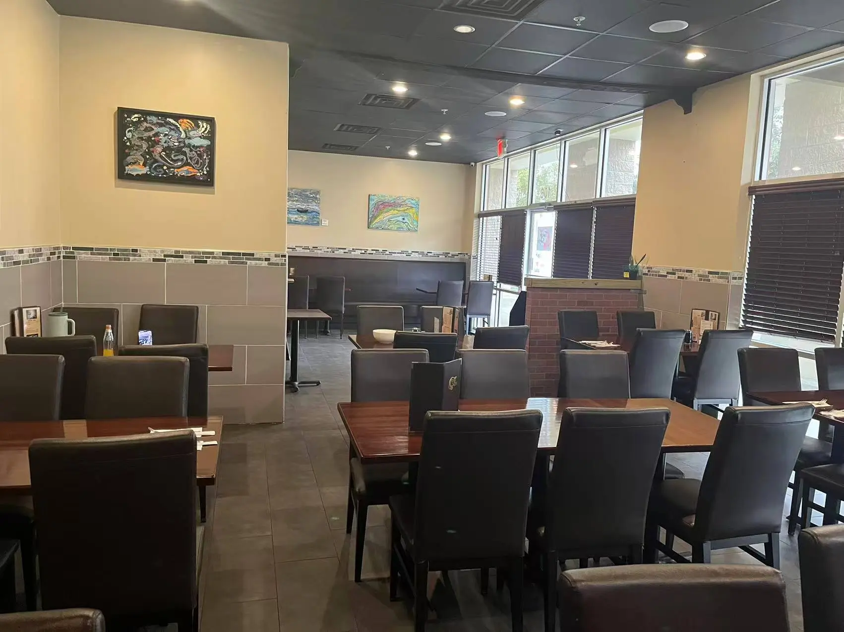 Spacious dining area with tables, booths and decorative art at Tokyo Sushi, a Japanese Restaurant in Ocala